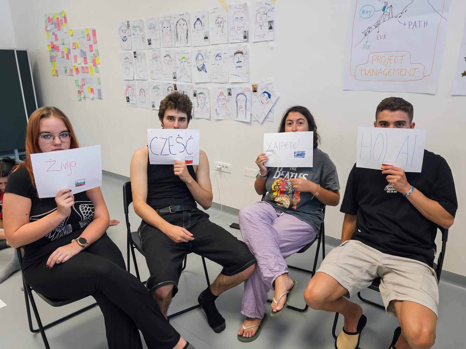 Small group discussion under the Youthpass poster during a workshop